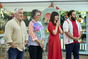 Paul Hollywood, Prue Leith, Casey Wilson and Zach Cherry getting ready to make an announcement on the Great American Baking Show on Roku Photo credit: Courtesy of Roku