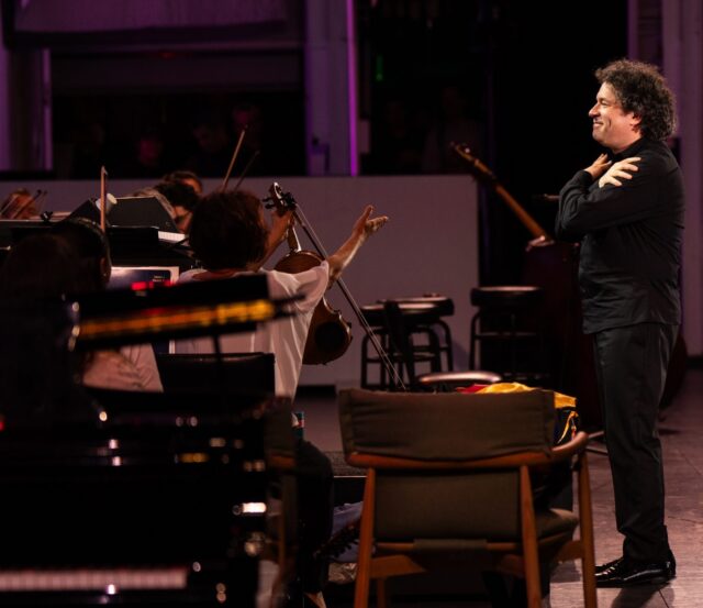 Gustavo Dudamel acknowledges the musicians of the Los Angeles Philharmonic during A Concert for Venezuela at the Hollywood Bowl. (Photo by Elizabeth Asher:LA Phil) Gustavo Dudamel