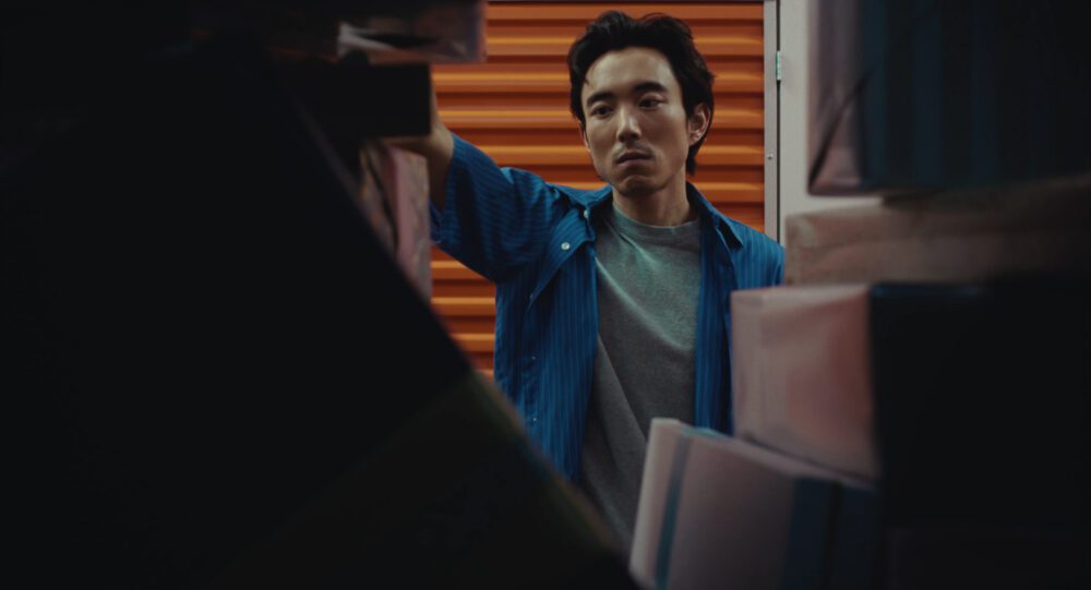 A man looking into a storage unit.