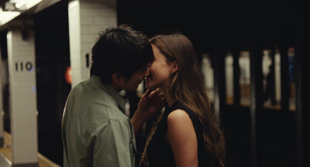 Two people kissing.
