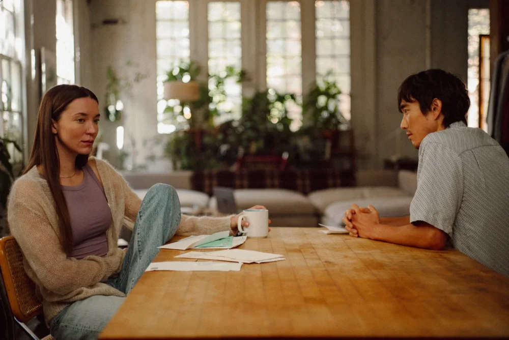 A woman and a man sitting at a table.