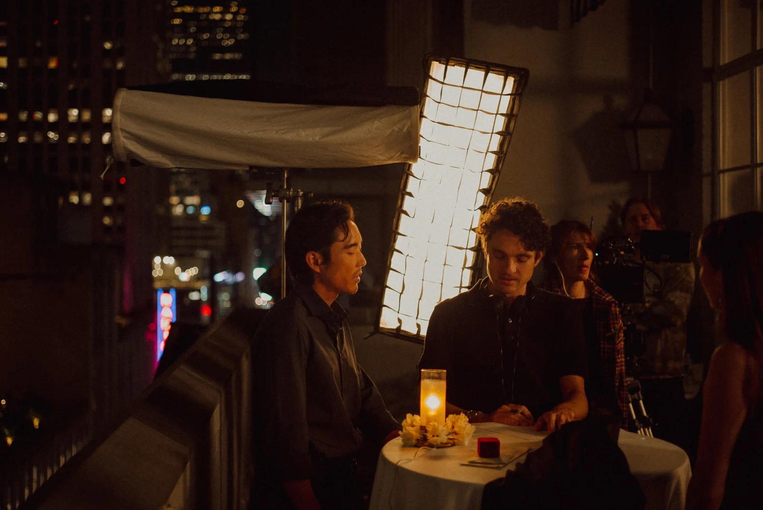 Two men in good lighting on set of movie.